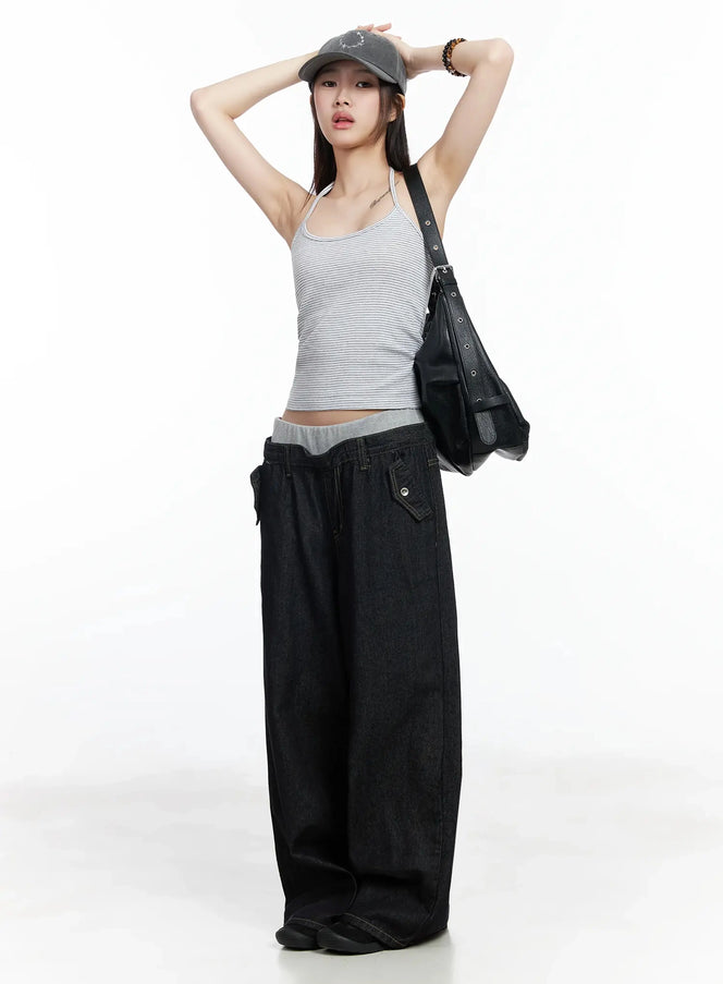 Striped Halter Tank Top IM506 in gray, full-body front shot on model with arms raised, slim cotton halter crop tank, styled with black wide-leg denim and crossbody bag.