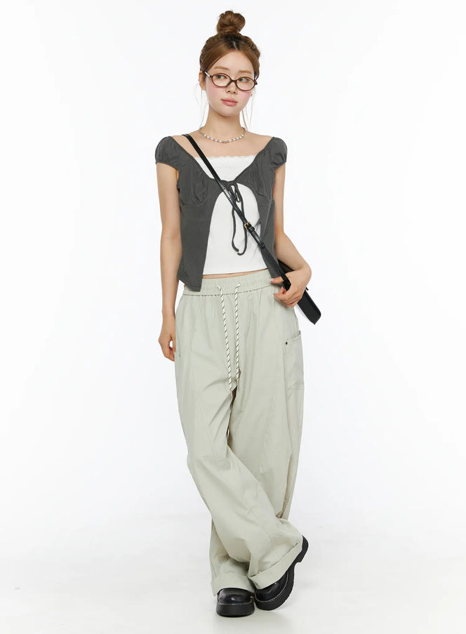 Wide Leg Cargo Pants CL501 Light beige full-length front shot on model with bun updo styled with gray crop top and black crossbody bag